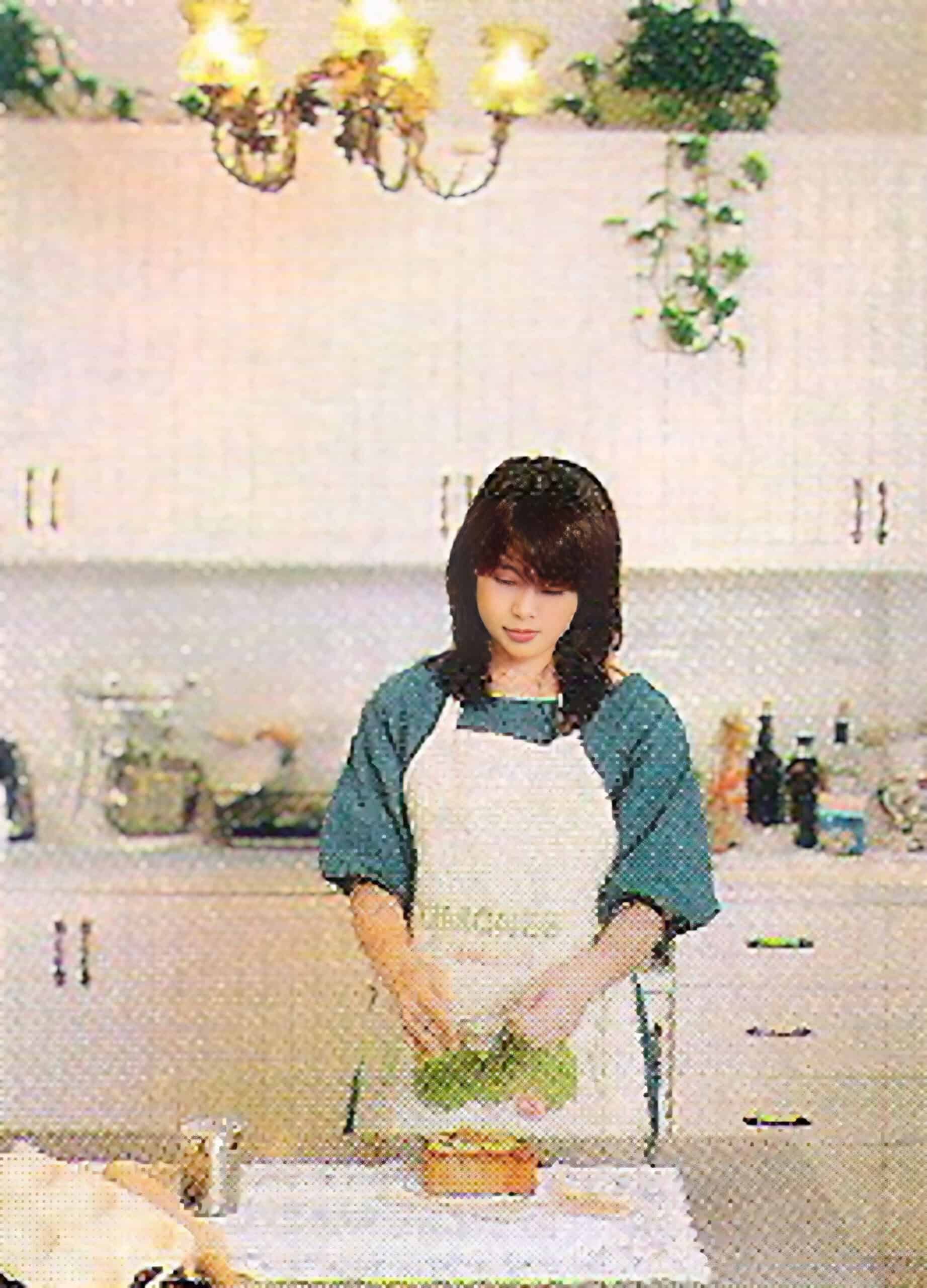 Bonnie is standing in the kitchen