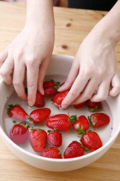 Rinse the strawberries for Strawberry Jam